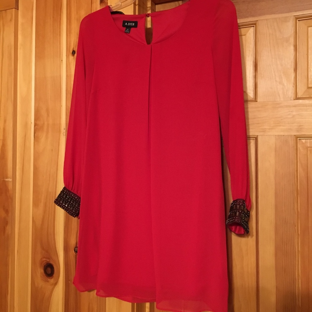 Red tunic with black detail beading.
